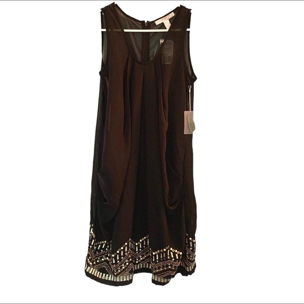 Elegant Black Sleeveless Dress with Embellished Hem